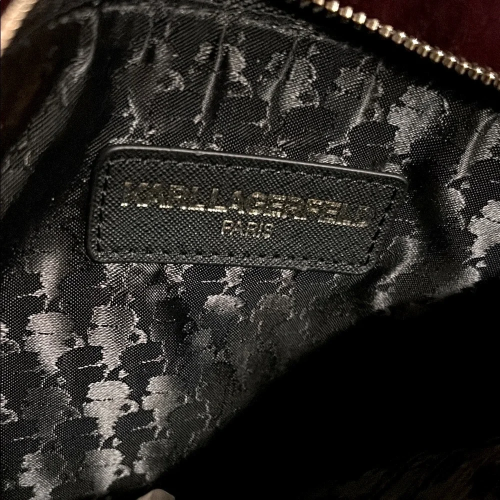 Karl Lagerfeld Paris Double Zip Wristlet Pouch Clutch in a plum combo print.
